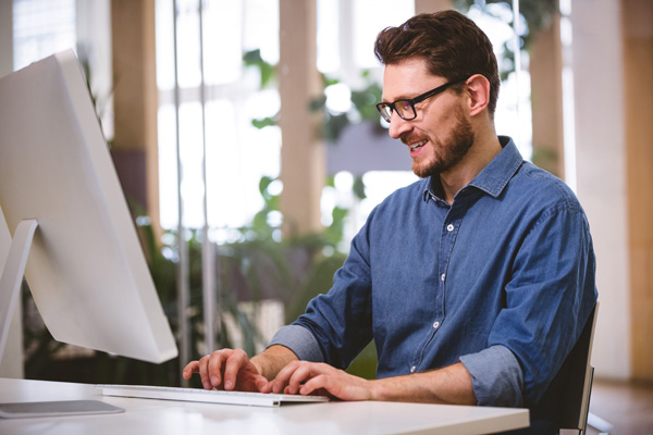 Bearded man with glasses selling adult Ecommerce site on desktop