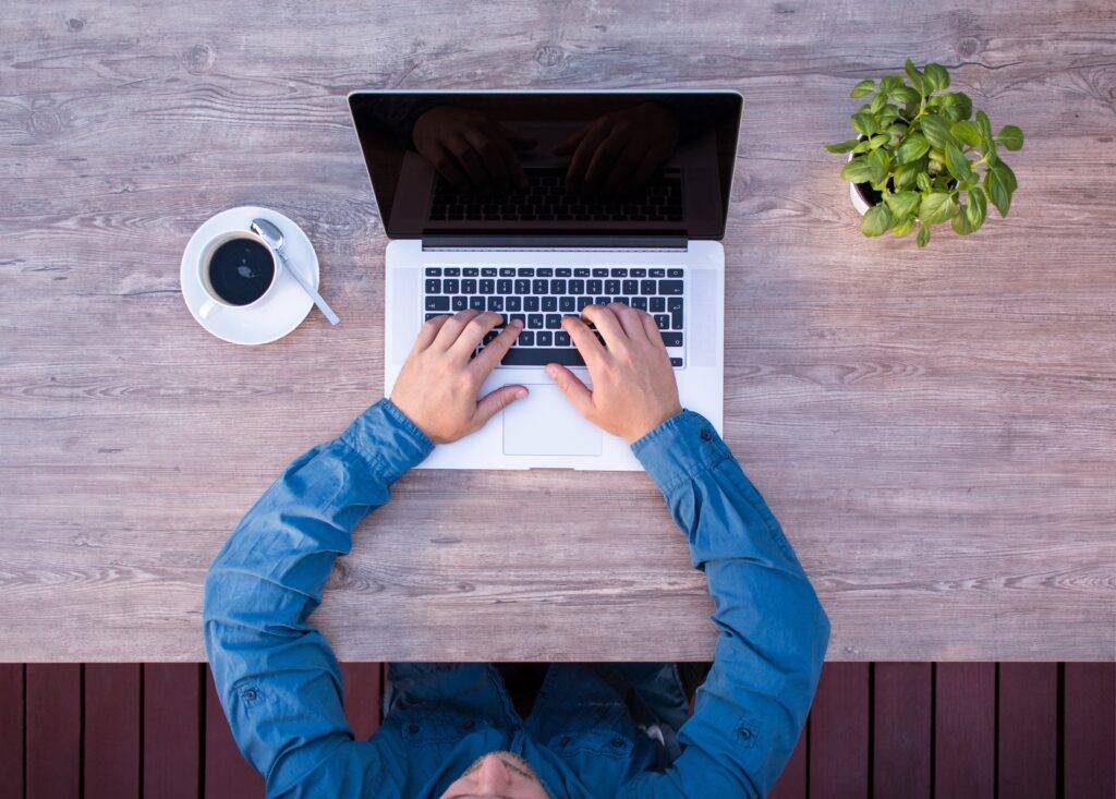 An Amazon FBA Broker working at a desk